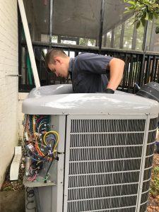 Jonathan cleaning outdoor unit