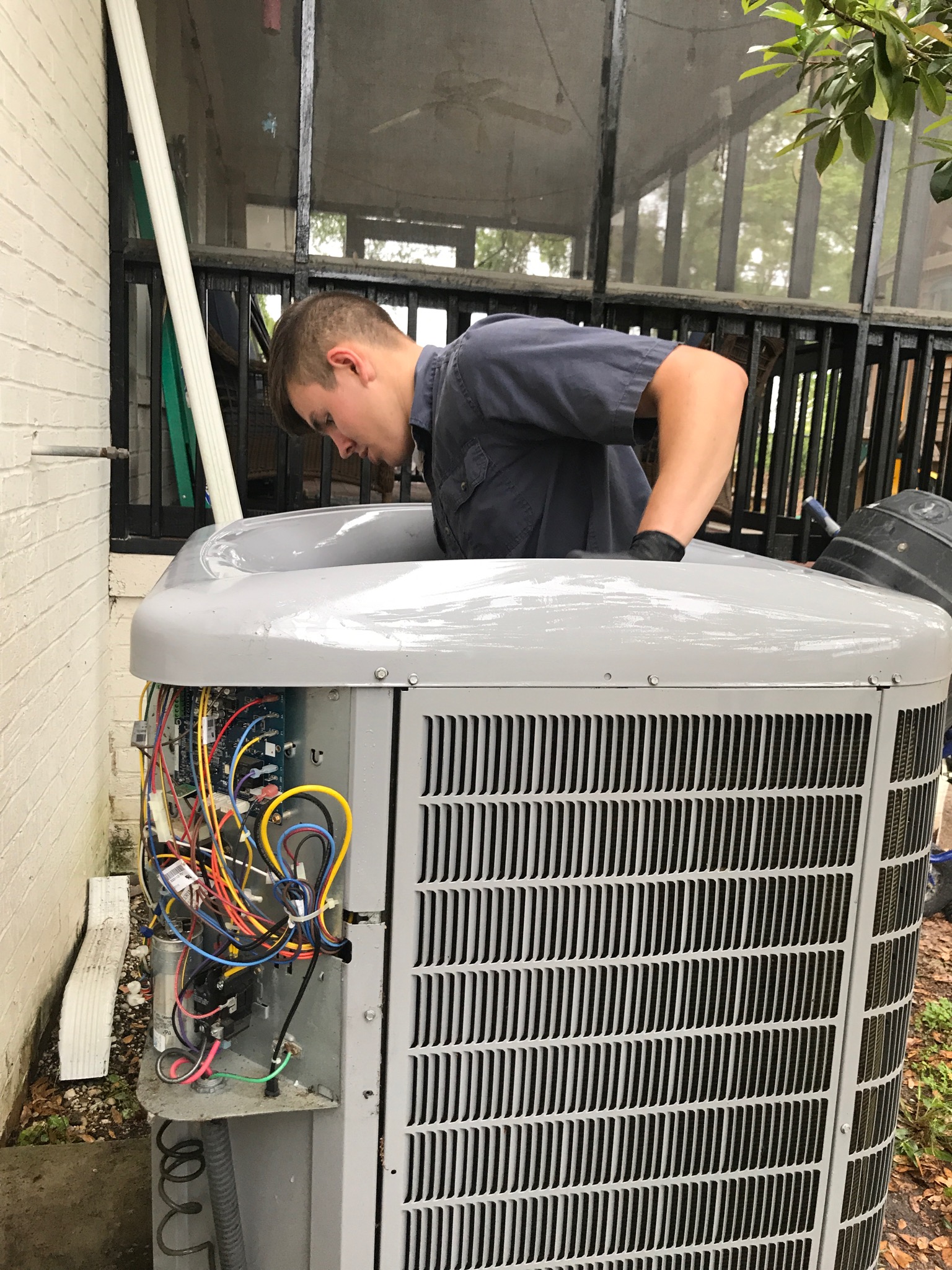 Jonathan cleaning outdoor unit